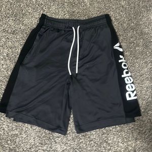 Brand: Reebok  Color: Black and Grey  Size: Boys 16